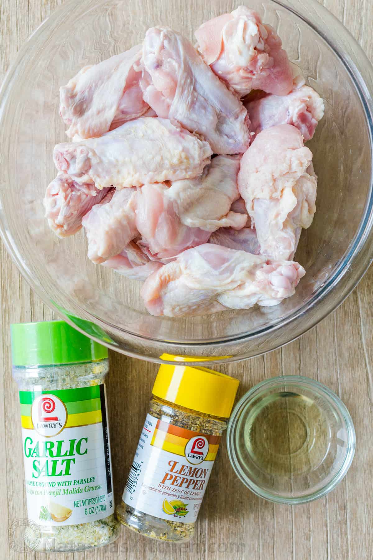 Air Fryer Chicken Wings with crisp salty skin, perfectly seasoned with garlic and lemon pepper. Air fried chicken wings cook so fast with no marinating! #airfryer #airfryerchicken #airfryerchickenwings #chickenwings #crispchickenwings #chicken #airfryerrecipes #natashaskitchen Ingredients for air fryer chicken with wings, drummettes, garlic salt and lemon pepper