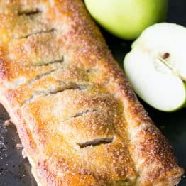 Caramelized apples wrapped in flaky puff pastry dough. So EASY and delicious! @natashaskitchen