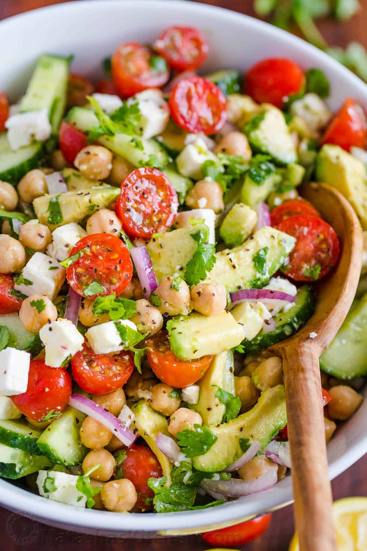 Chickpea Salad Recipe in a bowl with avocados, tomatoes, chickpeas and feta cheese