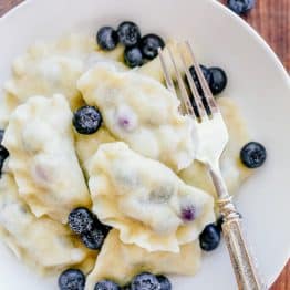Blueberry pierogi are the ultimate comfort food. Our family has been making pierogi (vareniki) for generations. Watch this video for how to make pierogies! | natashaskitchen.com