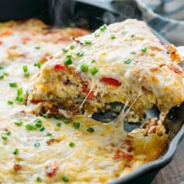This breakfast casserole goes from stove to oven in one pan. Under the gooey cheesy crust, it's loaded with bacon, hash browns and of course, more cheese!