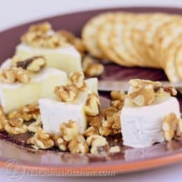 The combination of brie with walnuts, dripping with honey is addictive. It always goes fast when served at parties and so easy to put it together.