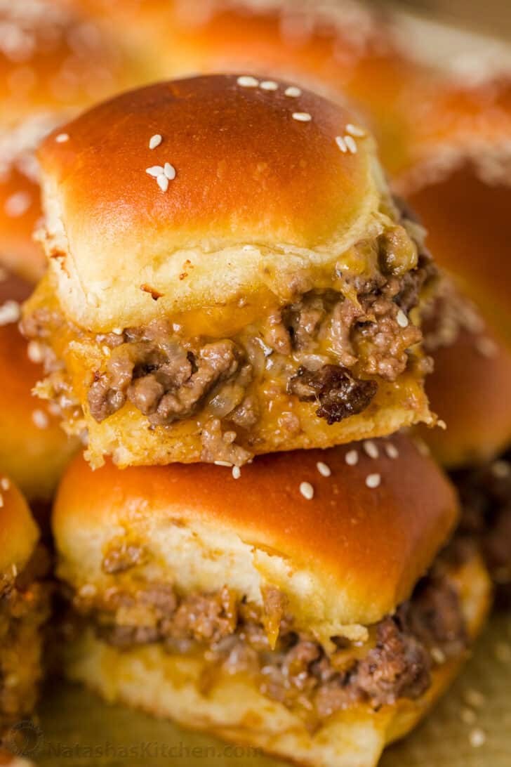Cheeseburger Sliders are juicy, cheesy and beefy and everything we love about burgers. Sliders are quick and easy, make-ahead, and reheat really well. Stacked cheeseburger sliders