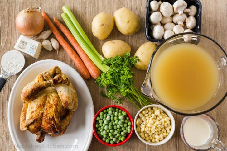 Ingredients for chicken pot pie soup with chicken, vegetables, and potatoes. 