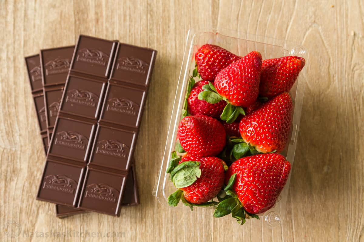 Ingredients for chocolate strawberries Chocolate bars and fresh strawberries
