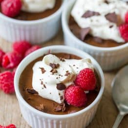 How to make Classic Chocolate Mousse that is decadent, airy and luxuriously chocolatey. Easy, sophisticated chocolate dessert with whipped cream and raspberries. #chocolatemousse #mousse #chocolatedessert #dessert #natashaskitchen #valentinesday #valentinesdaydessert #classicchocolatemousse #frenchchocolatemousse