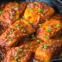 Cod fish in Tomato Sauce. The fish is flaky and juicy and the sauce is legit! | natashaskitchen.com