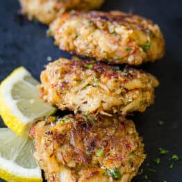 Crab Cakes on serving platter with lemon slices