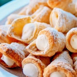 These puff pastry cream horns are easy and impressive for any special occasion! This is my Mother's cream horns recipe (aka trubochki).