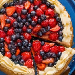 Our spin on the classic German Fruit Cake "Obstkuchen Obsttorte". It has a super soft cake base, is loaded with glazed berries and a secret ingredient stabilized whipped cream frosting! | natashaskitchen.com