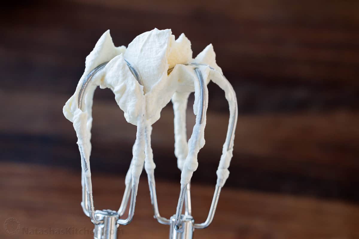 Make my Homemade Whipped Cream Recipe in less than 5 minutes with just 3 ingredients. Swap for Cool Whip for the best dessert dip or topping. Beaters showing what stiff peaks look like