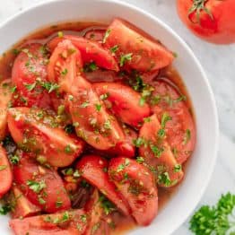 Addictively delicious! Served these marinated tomatoes at a potluck and everyone wanted the recipe! Marinated tomatoes are a great make-ahead side dish.