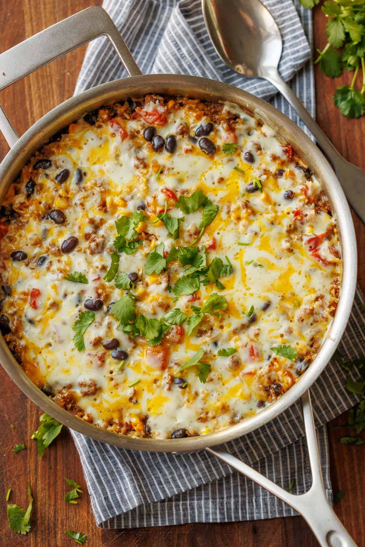 Mexican Beef and Rice skillet prepared and garnished with melted cheese and fresh cilantro