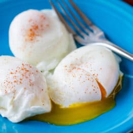 Poached Eggs served on a plate seasoned with paprika