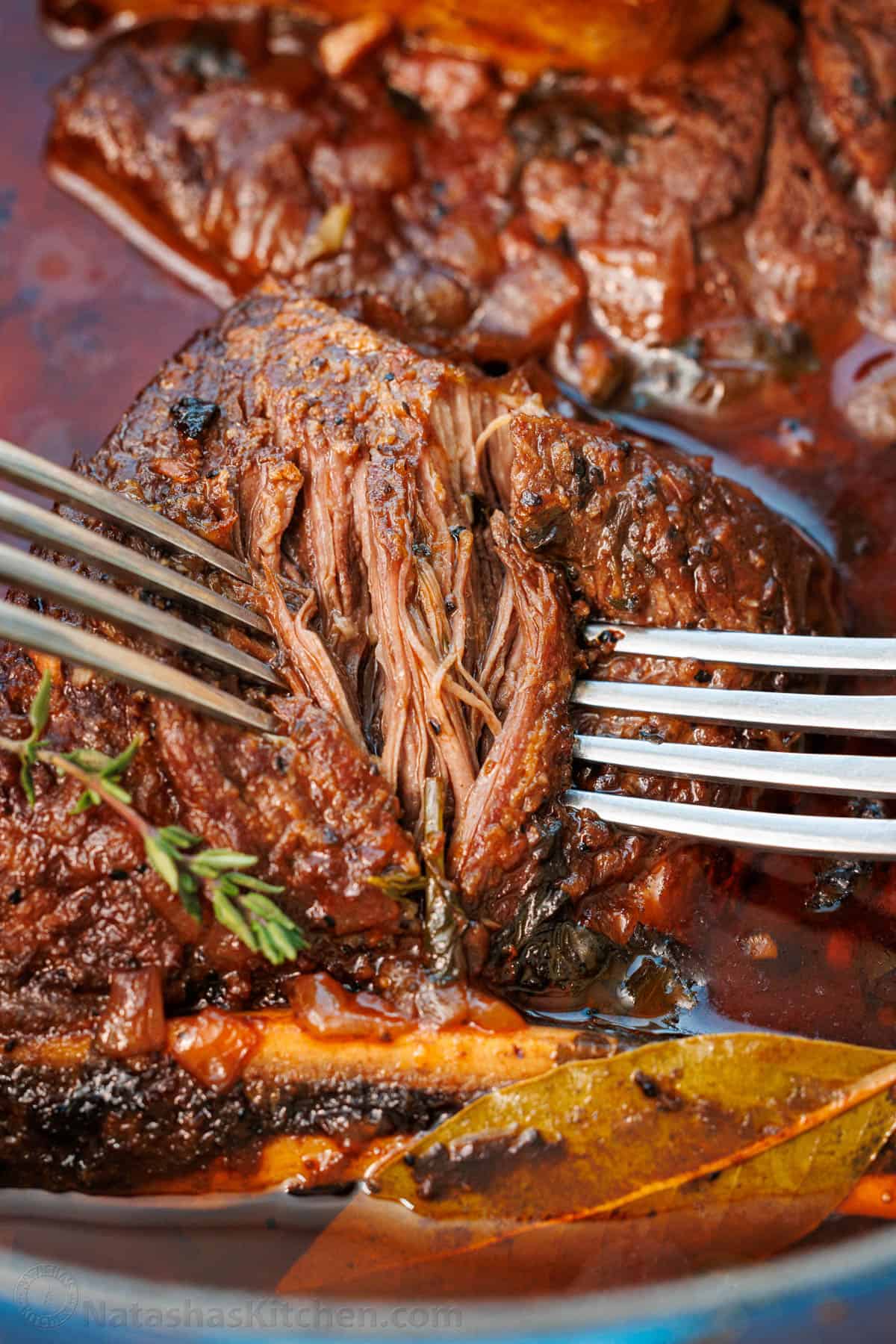 The best Pot Roast Recipe to get fall-apart tender beef with a rich sauce that doubles as a gravy. It will become your go-to comfort recipe! how to shred meat using two forks