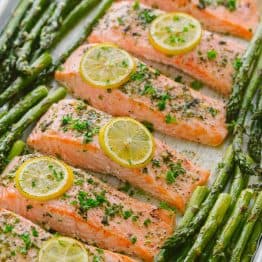 One-Pan Salmon Asparagus recipe with a lemon-garlic-herb butter. Every bite is so juicy and flavorful! A reader favorite, 20-minute salmon dinner. | natashaskitchen.com