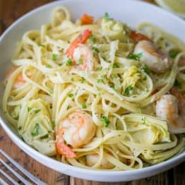 This shrimp and artichoke linguine is a 30-minute meal! It has a fresh and light lemon herb sauce - DELICIOUS!! | natashaskitchen.com