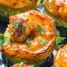 These shrimp appetizers have plump juicy cajun shrimp over creamy avocado on a crisp slice of cucumber. These shrimp cucumber bites are a delicious mouthful!