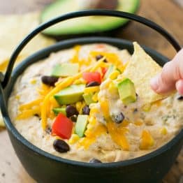 This Southwest hot chicken dip is cheesy, loaded with corn, black beans, and has just the right amount of heat from the jalapeños. Enjoy one pot recipe!