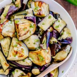 Spicy eggplant is my all-time favorite eggplant recipe. Hands down. Ogoniok (Огонек) means "little fire." Must-try eggplant recipe from the old country! | natashaskitchen.com
