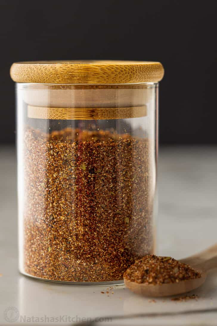 This easy Homemade Taco seasoning works for any recipe that calls for taco seasoning. It is tastier, healthier, and cheaper than store-bought. Jar of homemade taco seasoning with spoonful of seasoning next to it