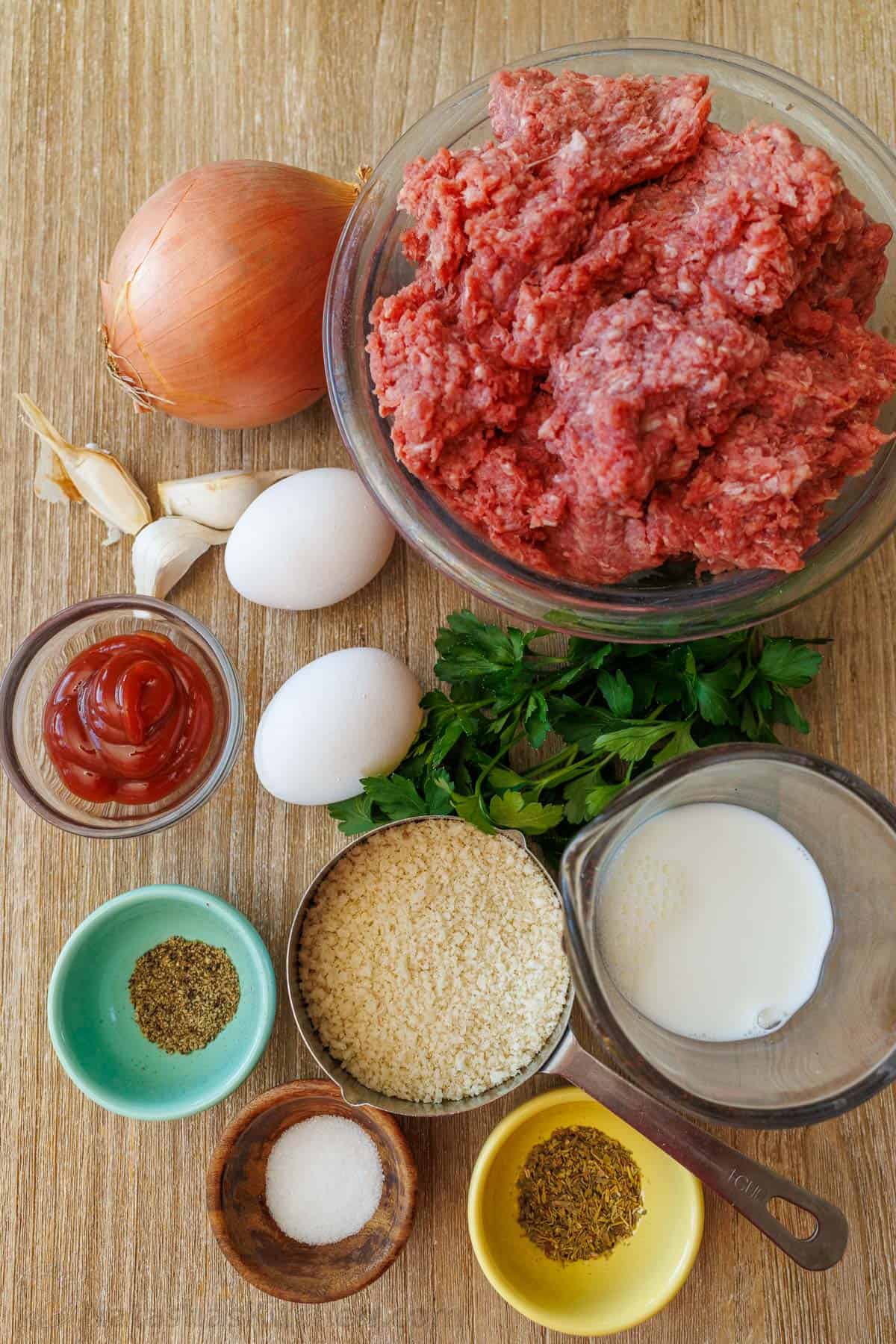 This is my favorite meatloaf recipe. The meatloaf is tender and juicy on the inside with a sweet and tangy glaze that adds so much flavor! Meatloaf Recipe Ingredients with ground beef, bread crumbs, onion, egg, milk, ketchup and seasonings.