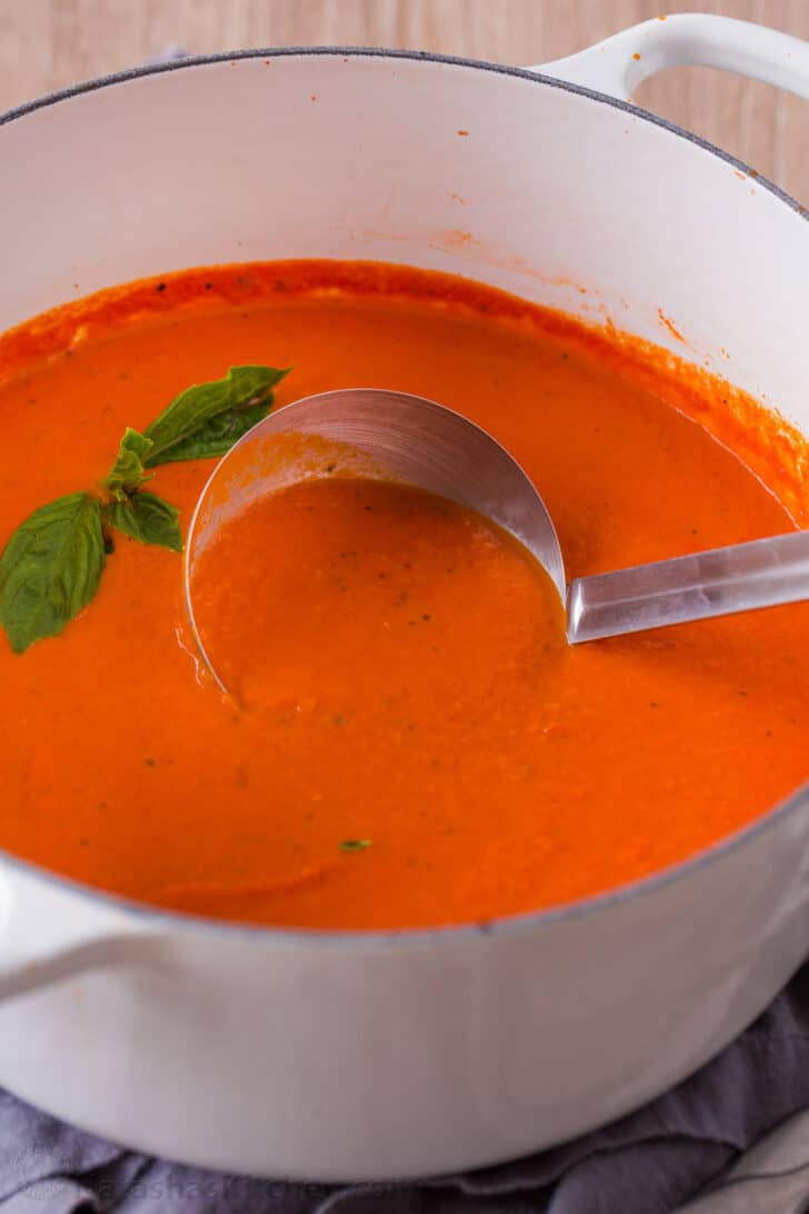Homemade Creamy Tomato Soup is an easy 30-minute recipe. Tomato basil soup has a rich flavor profile and is balanced with cream and parmesan. Tomato basil soup cooked in dutch oven nonreactive pot