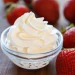 Homemade whipped cream piped into a dish